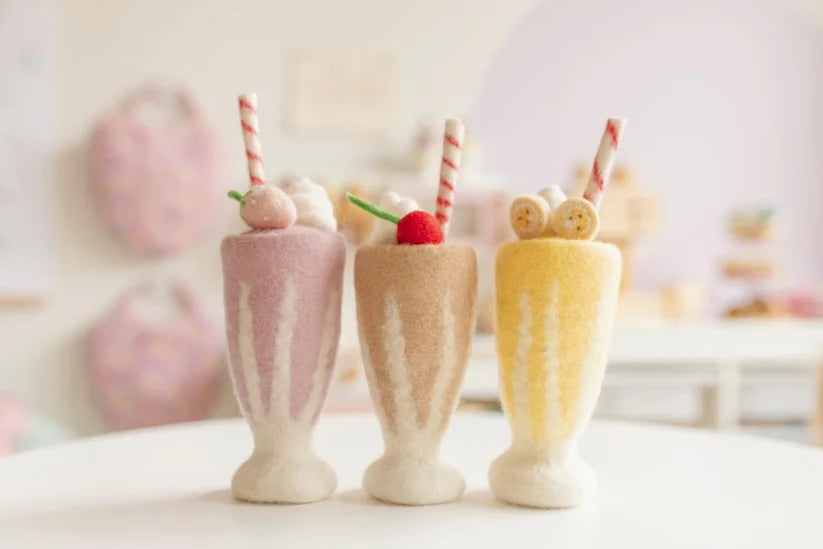 view of felt strawberry, chocolate and banana milkshake toy handmade wool pretend play drink diner Juni Moon