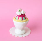 Rainbow felt sundae on pastel pink background