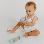 Baby Calm Down Bottle in Soft Blue with floating star glitter sensory elements for tummy time