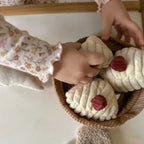 Child playing with the Little Lamb Kind Cake Baking Pretend Play Set with soft sensory baking toys
