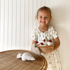Little Lamb Kind pretend baking toy set featuring plush cake slices, oven mitt and baking accessories