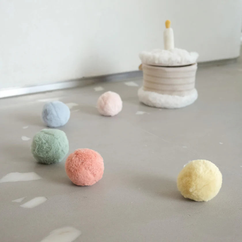 Child playing with Little Lamb Kind Count and Toss Cake educational toy