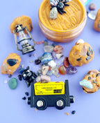 Kids mining themed sensory play set with textured dough, shovel, toy cart, crystals and rocks arranged for tactile excavation and small world play