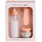 packaging of my first tiny tummies gift set, for pretend play with baby dolls. great for gifting and this pack includes a milk bottle that disappears, the magic spoon to the jar of tiny tummies baby cereal
