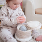 Plush birthday cake storage toy with soft sensory toss balls