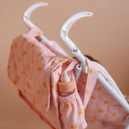 showing how the tiny harlow nurturer kit can fit on the back of baby doll kids stroller for pretend play with kids dolls made by brand tiny harlow. print pictured is pink ducky
