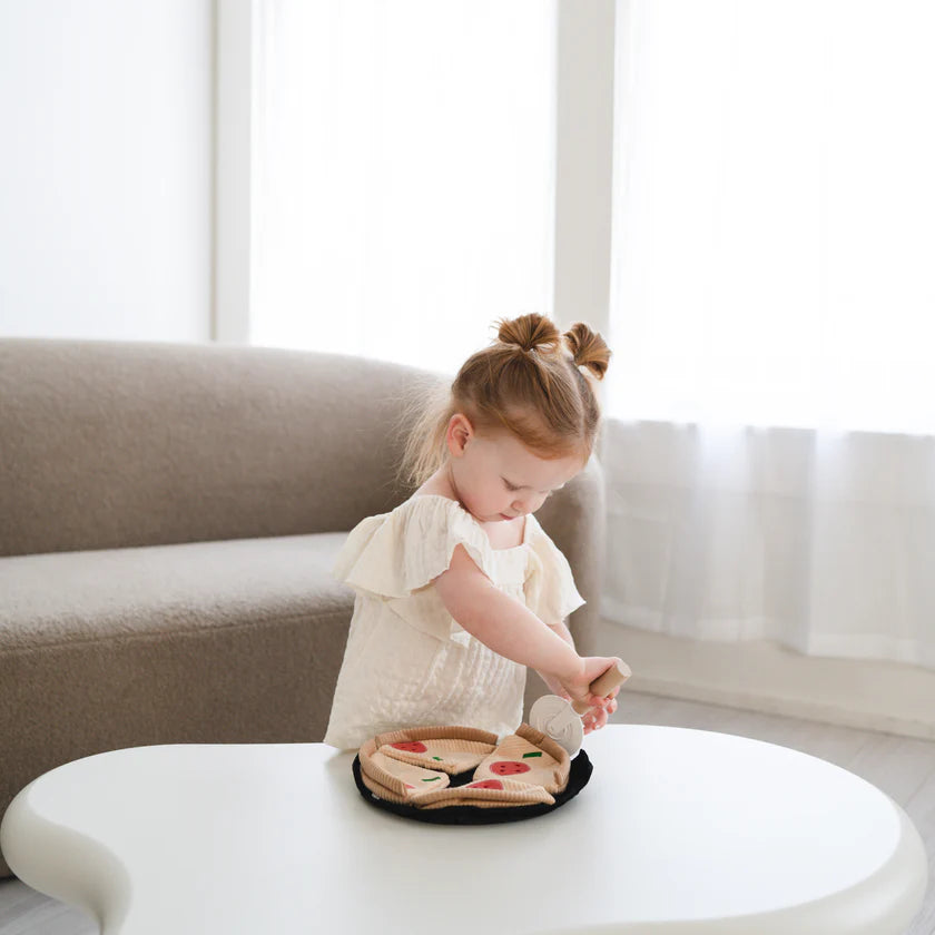 Child playing with Little Lamb Kind plush pizza pretend play set