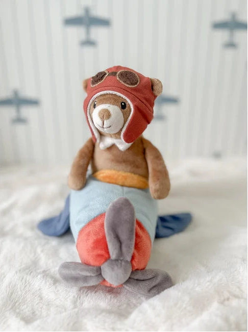 lifestyle image From the brand mon ami Set on a soft aeroplane and dressed in a classic pilot helmet, this sweet bear pilot 